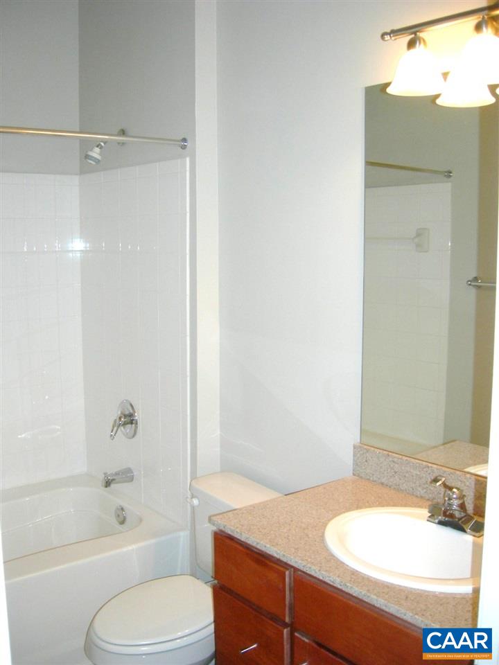 775 Walker Square, Unit 3C Charlottesville, VA 22903 - Photo 7 of 17 a bathroom with a sink toilet and shower