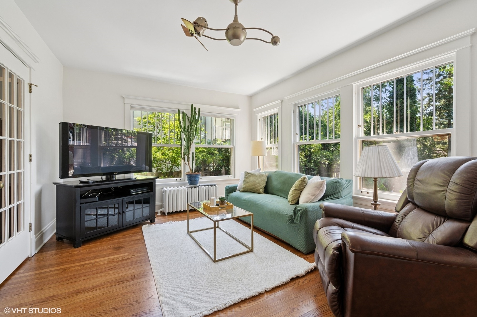 623 Forest Avenue Wilmette, IL 60091 - Photo 15 of 43 a living room with furniture a flat screen tv and a large window