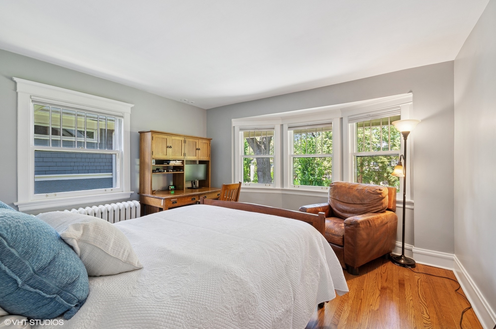 623 Forest Avenue Wilmette, IL 60091 - Photo 21 of 43 a bedroom with a bed and glass window