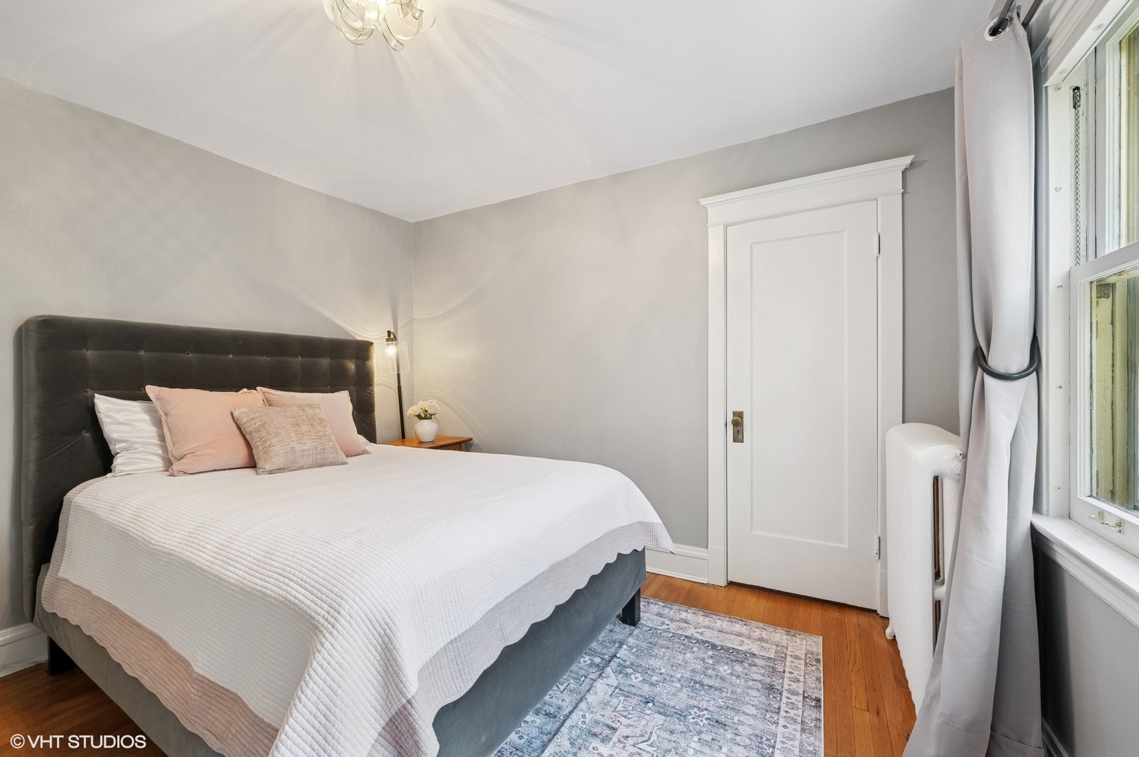 623 Forest Avenue Wilmette, IL 60091 - Photo 22 of 43 a bedroom with a bed and a mirror