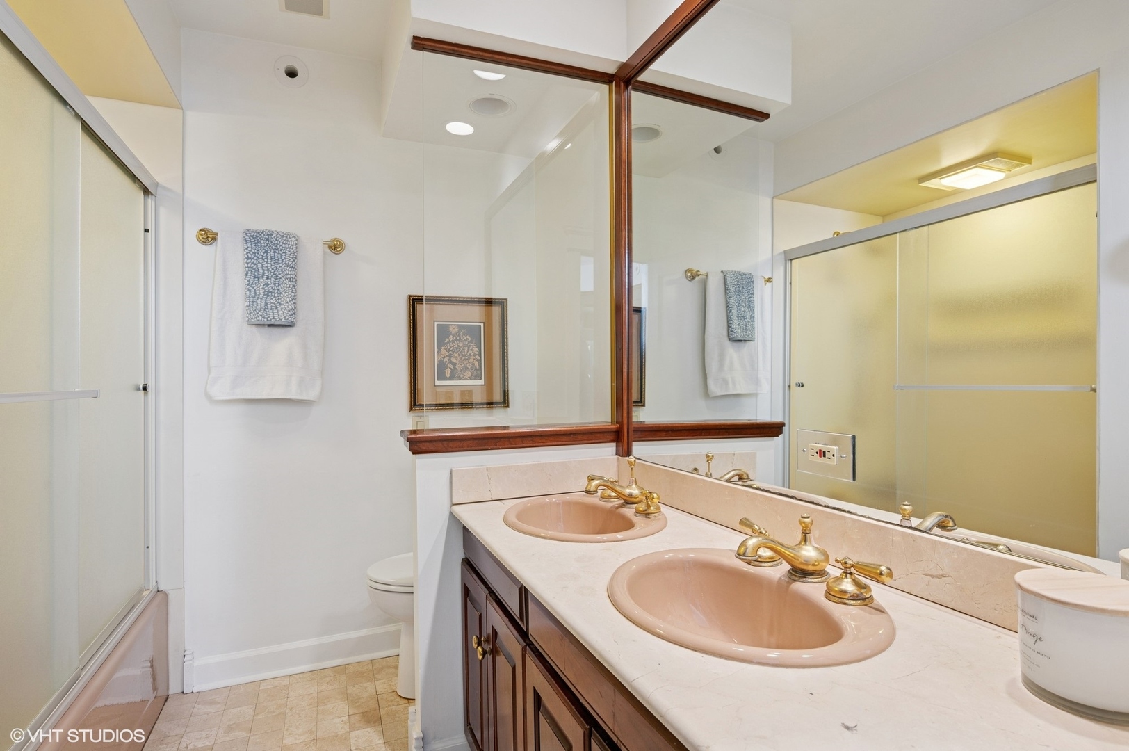 623 Forest Avenue Wilmette, IL 60091 - Photo 24 of 43 a bathroom with a sink double vanity and a mirror