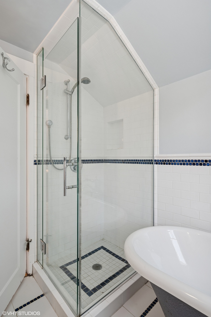 623 Forest Avenue Wilmette, IL 60091 - Photo 29 of 43 a bathroom with a shower