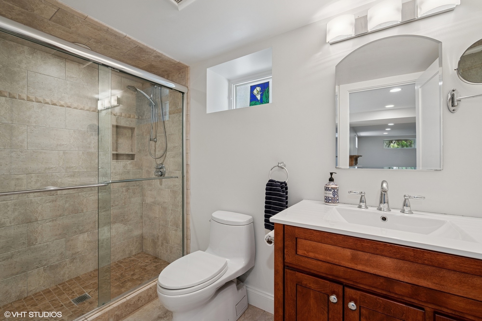 623 Forest Avenue Wilmette, IL 60091 - Photo 34 of 43 a bathroom with a sink a toilet and shower