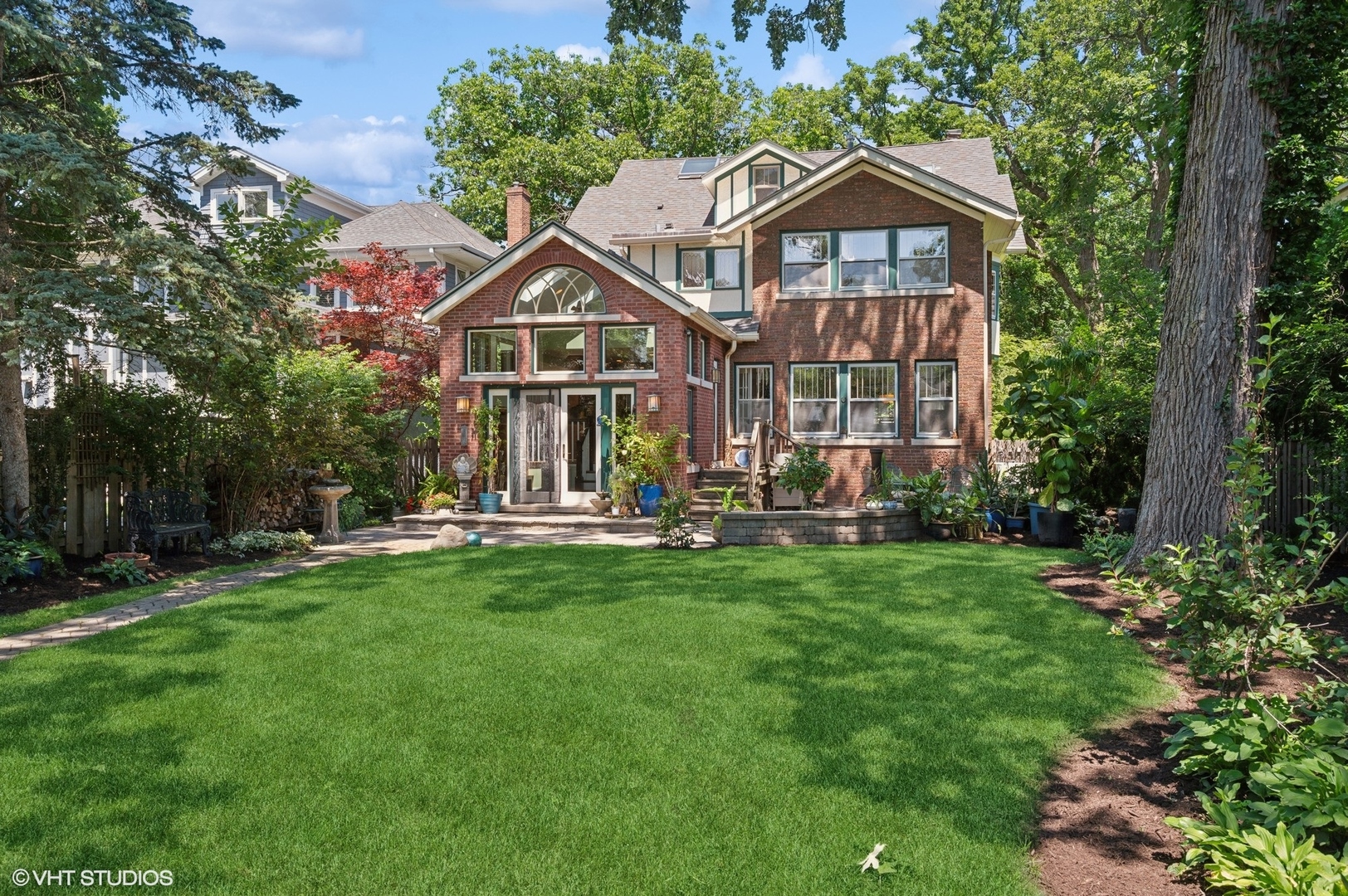 623 Forest Avenue Wilmette, IL 60091 - Photo 37 of 43 a front view of a house with a garden