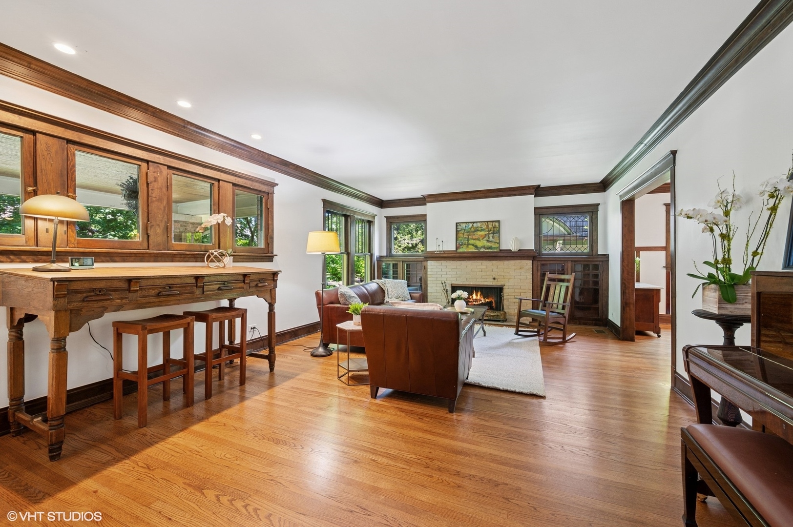 623 Forest Avenue Wilmette, IL 60091 - Photo 4 of 43 a living room with furniture a fireplace and a large window