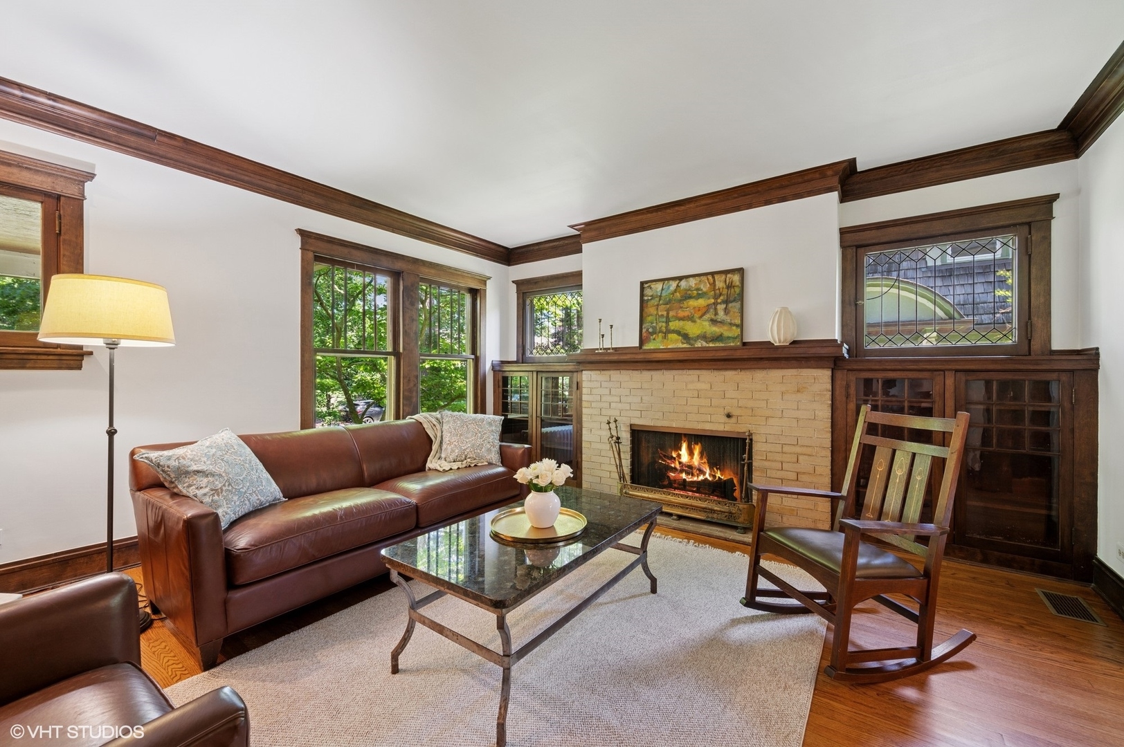 623 Forest Avenue Wilmette, IL 60091 - Photo 6 of 43 a living room with furniture and a fireplace