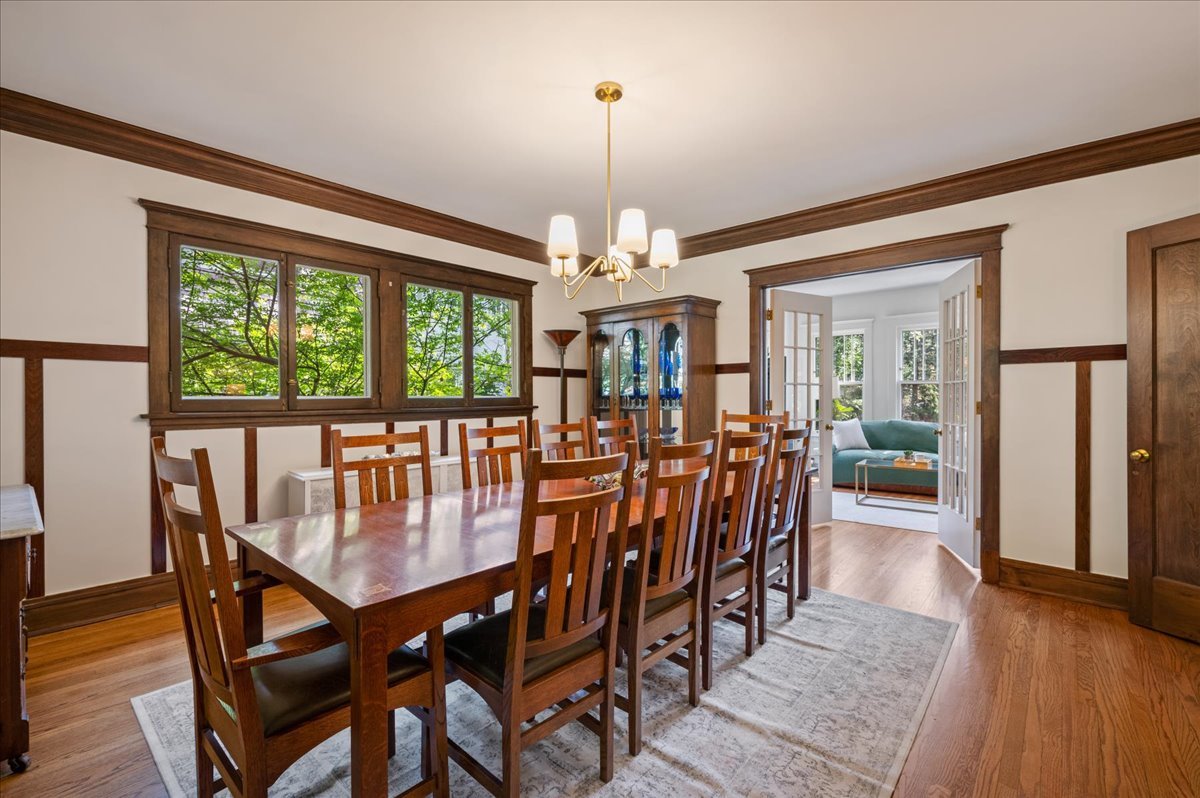 623 Forest Avenue Wilmette, IL 60091 - Photo 7 of 43 a view of a dining room with furniture wooden floor and chandelier