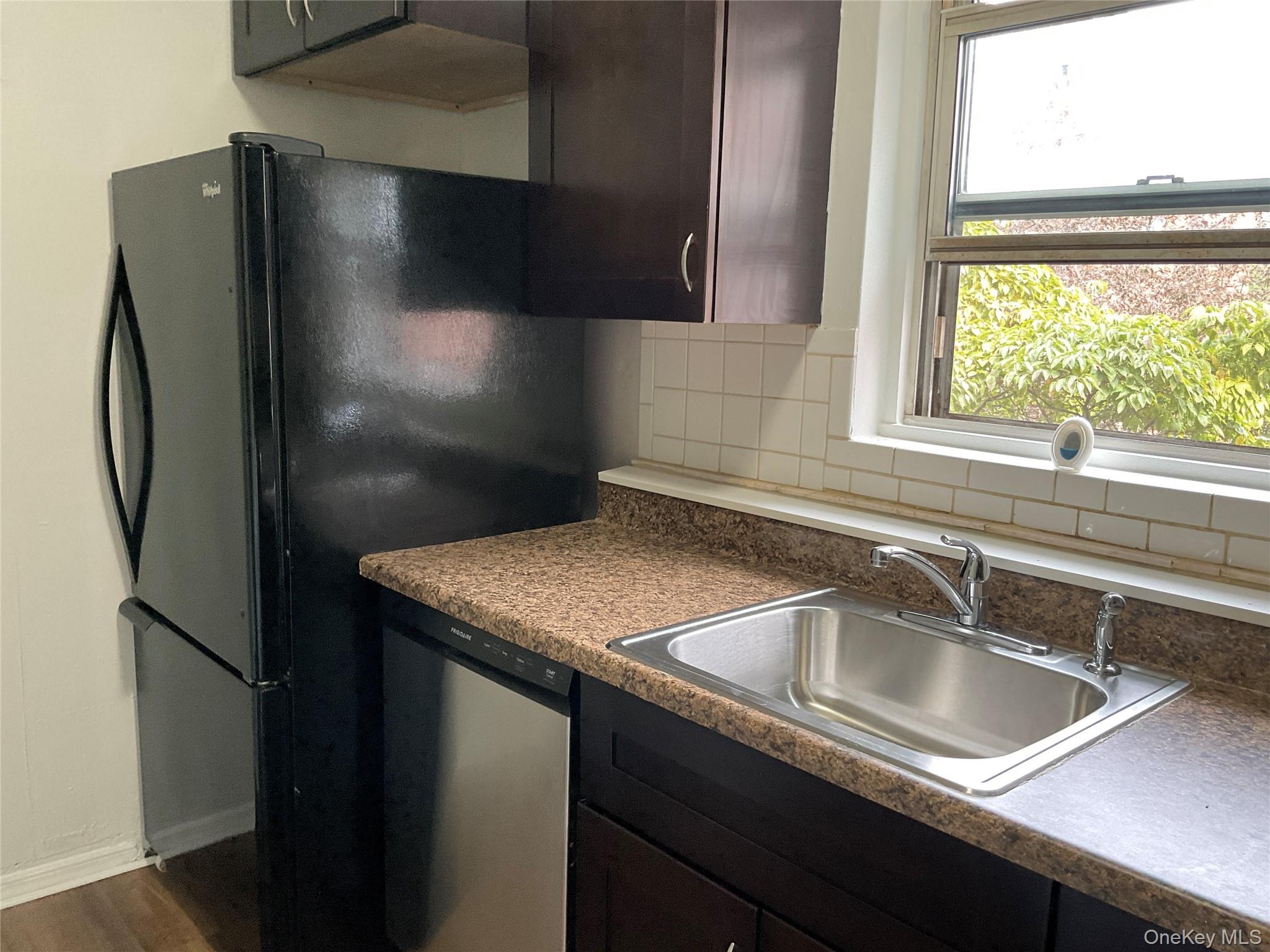 320 South Broadway, Unit P8 Tarrytown, NY 10591 - Photo 11 of 21 a kitchen with a sink and a refrigerator