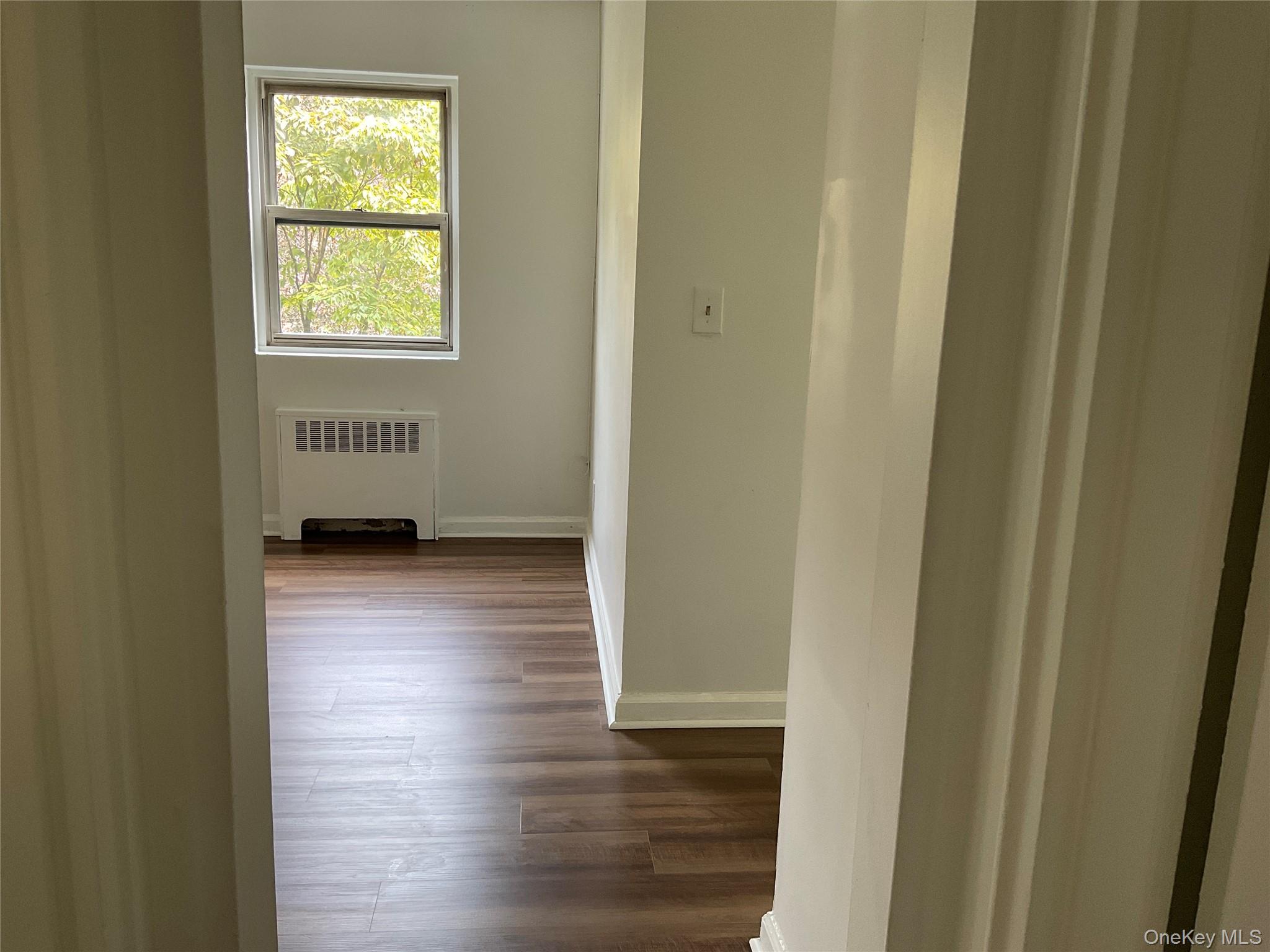 320 South Broadway, Unit P8 Tarrytown, NY 10591 - Photo 13 of 21 a view of a livingroom with wooden floor and a window