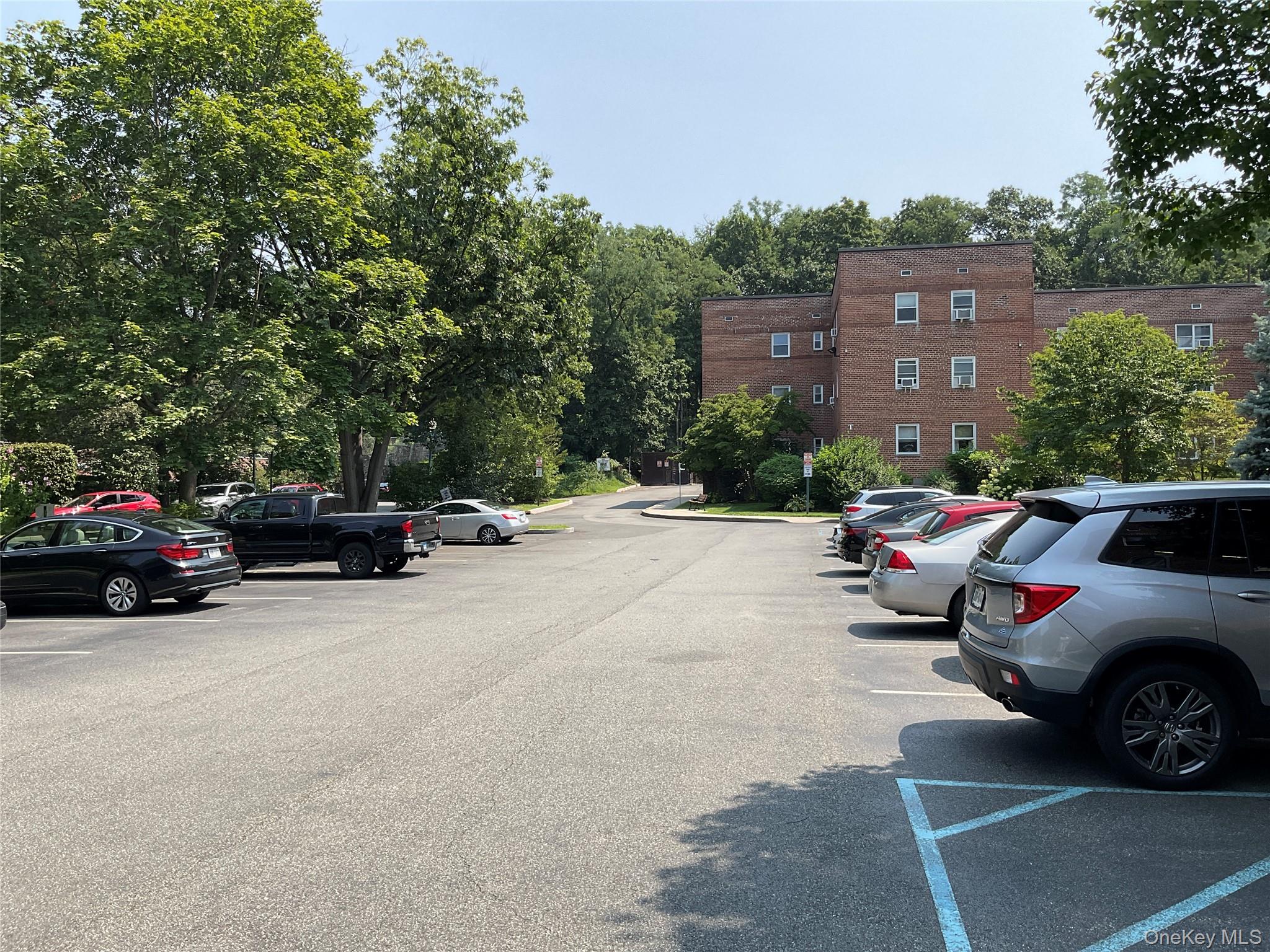 320 South Broadway, Unit P8 Tarrytown, NY 10591 - Photo 19 of 21 a view of road with card parked on side and retail shops