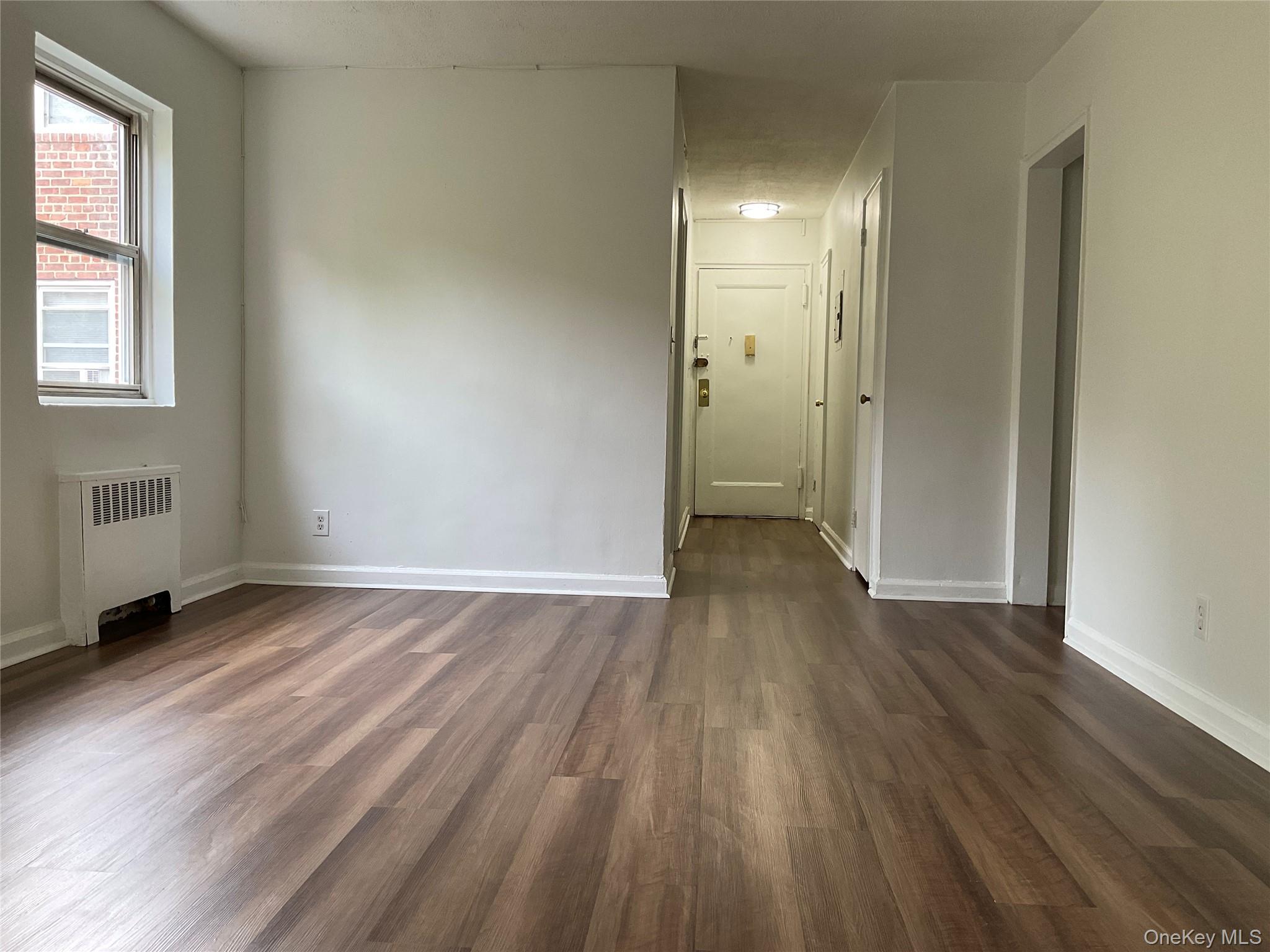 320 South Broadway, Unit P8 Tarrytown, NY 10591 - Photo 8 of 21 an empty room with wooden floor and windows