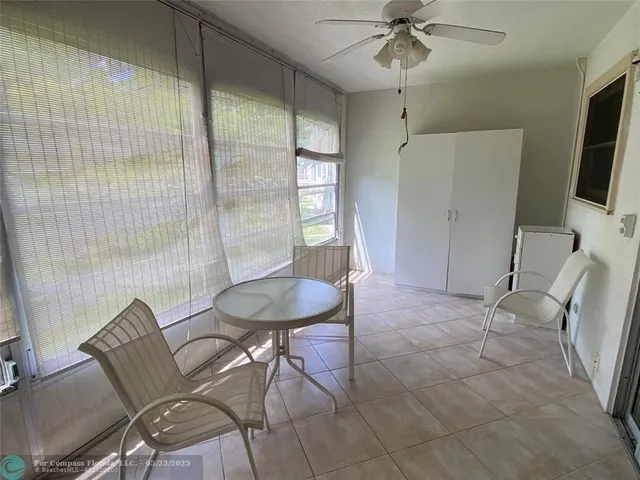 a view of a livingroom with furniture and a flat screen tv