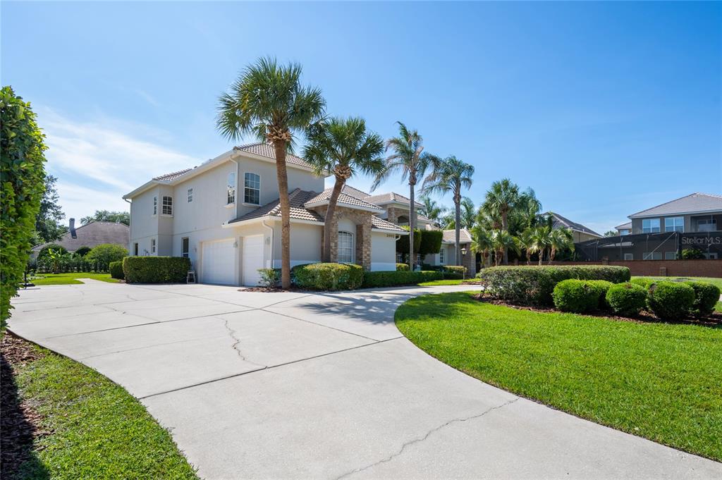 2002 Water Key Drive Windermere, FL 34786 - Photo 57 of 60 a front view of a house with a yard