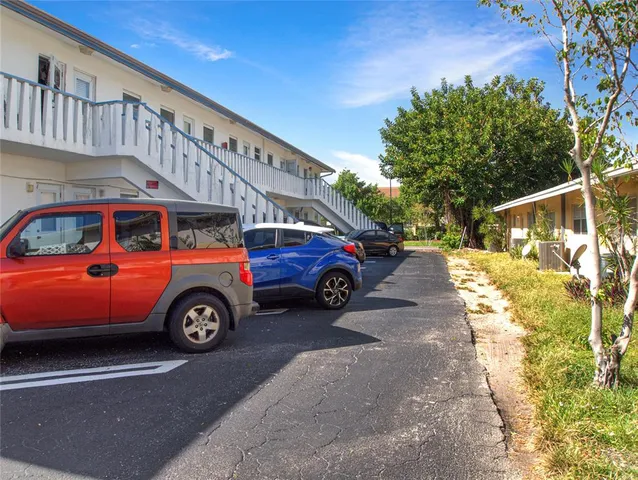 a front view of a house with parking space