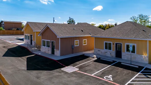 an aerial view of houses with deck
