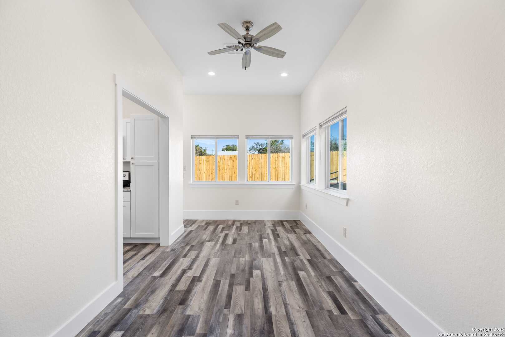 705 Fifth Street, Unit B Comfort, TX 78013 - Photo 25 of 30 wooden floor in an empty room with a window