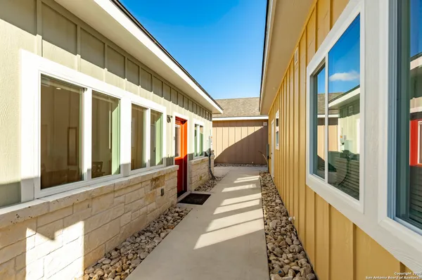 a front view of house with yard slide and outdoor seating