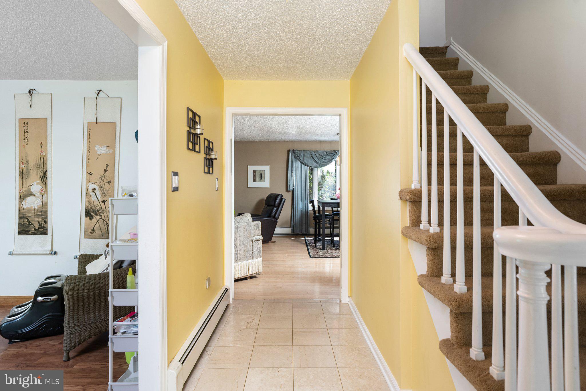87 Bordentown Chesterfield Road Chesterfield, NJ 08515 - Photo 4 of 49 a view of a hallway with wooden floor and staircase