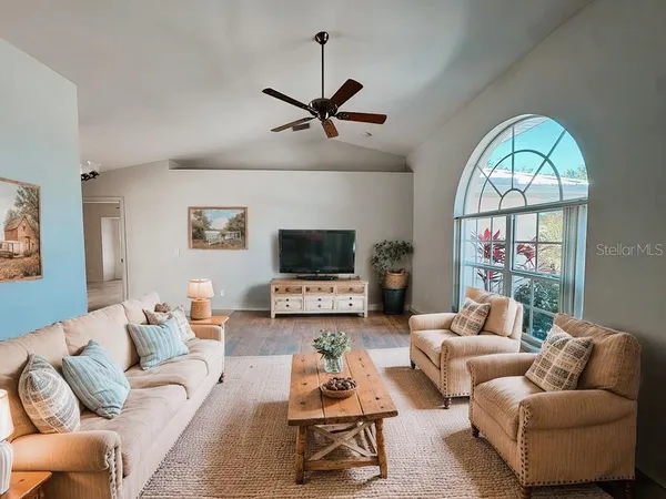 a living room with furniture fireplace and a flat screen tv