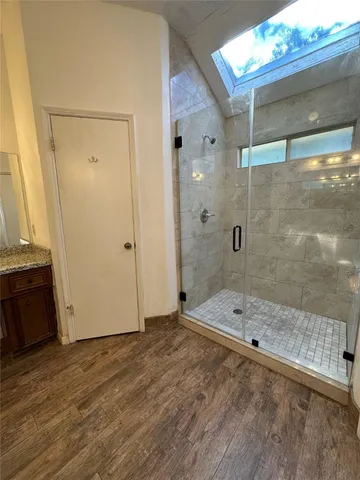 a bathroom with a bathtub and a shower
