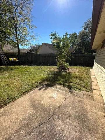 a view of a yard with an trees