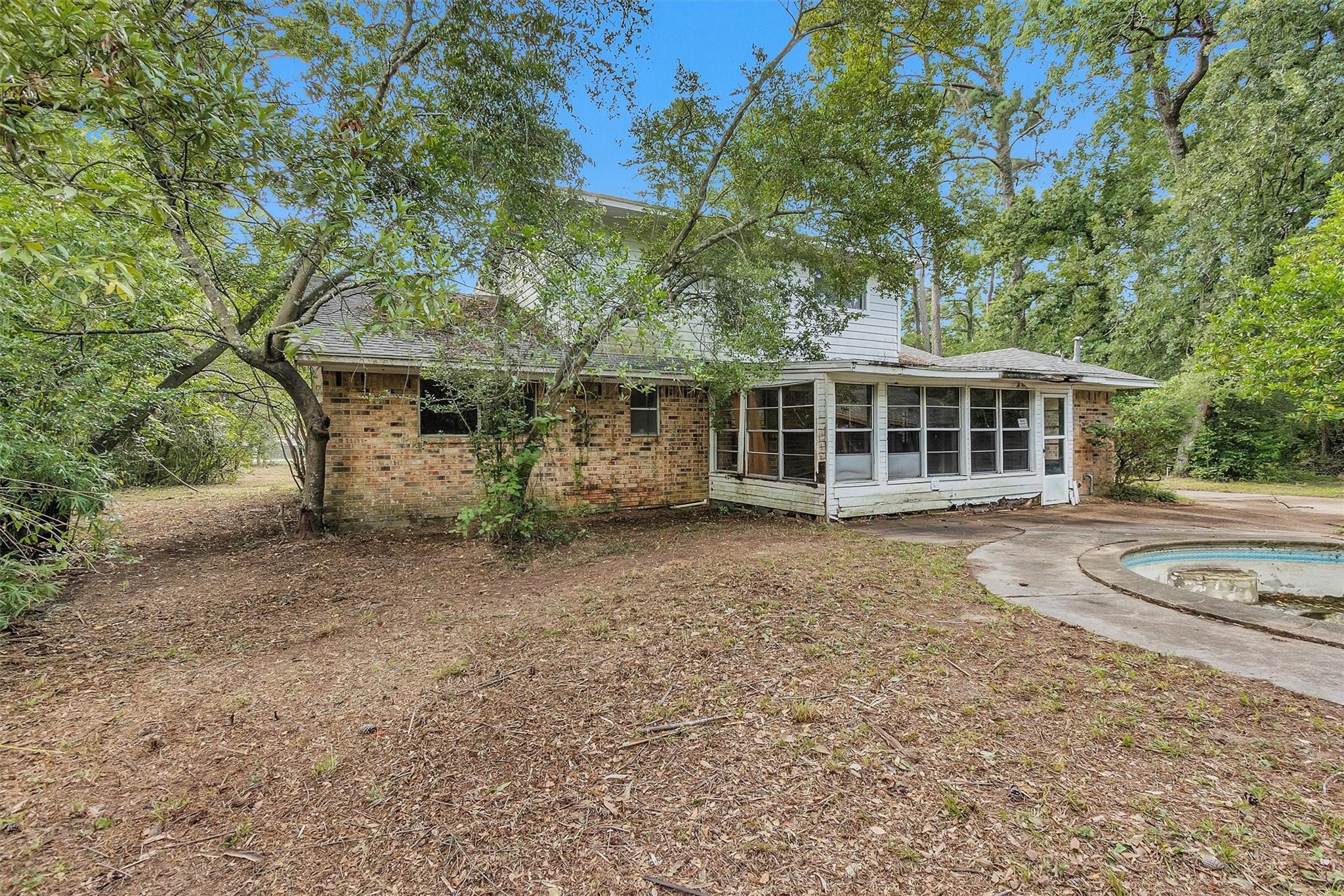 29526 West Hawthorne Drive Spring, TX 77386 - Photo 3 of 13 a view of a house with a yard