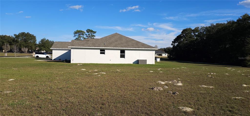 70th Street Silver Springs, FL 34488 - Photo 16 of 30 a front view of a house with a yard