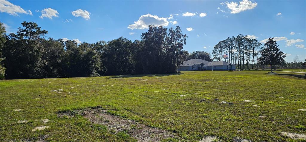 70th Street Silver Springs, FL 34488 - Photo 7 of 30 a view of a swimming pool with an outdoor space and seating area