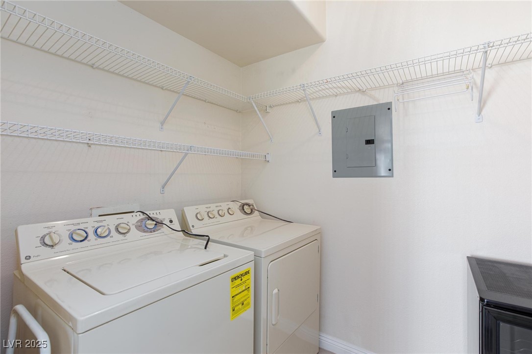 7185 South Durango Drive, Unit 201 Las Vegas, NV 89113 - Photo 12 of 27 Laundry room with washing machine and dryer