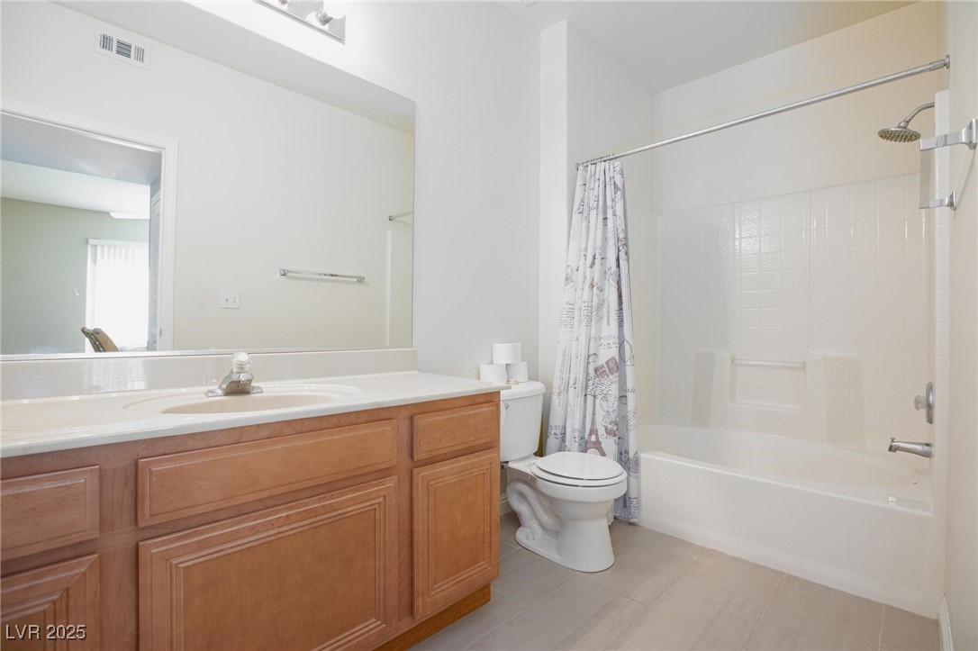 7185 South Durango Drive, Unit 201 Las Vegas, NV 89113 - Photo 21 of 27 Bathroom with shower / tub combo and vanity