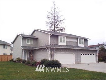 12116 Alexander Road Everett, WA 98204 - Photo 1 of 16 a front view of a house with garden