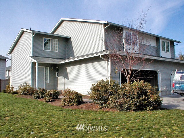 12116 Alexander Road Everett, WA 98204 - Photo 16 of 16 a view of a house with a yard and plants