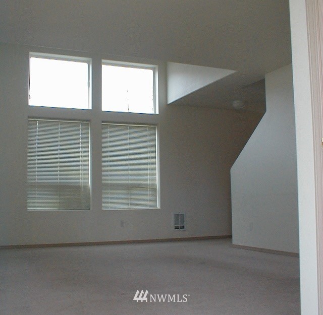 12116 Alexander Road Everett, WA 98204 - Photo 9 of 16 a view of an empty room with a window