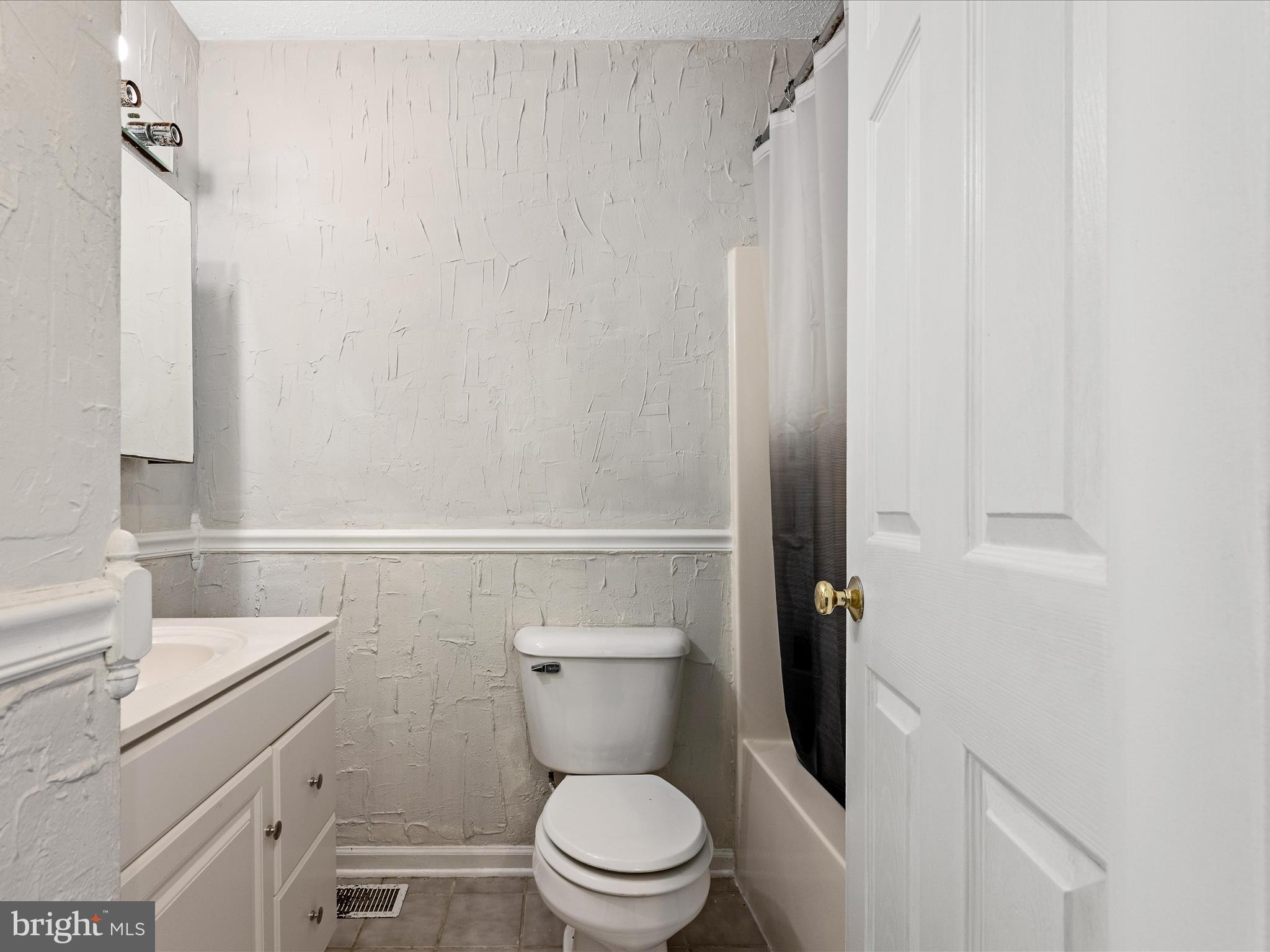 521 East 11th Avenue Ranson, WV 25438 - Photo 12 of 41 a white toilet sitting next to a white sink