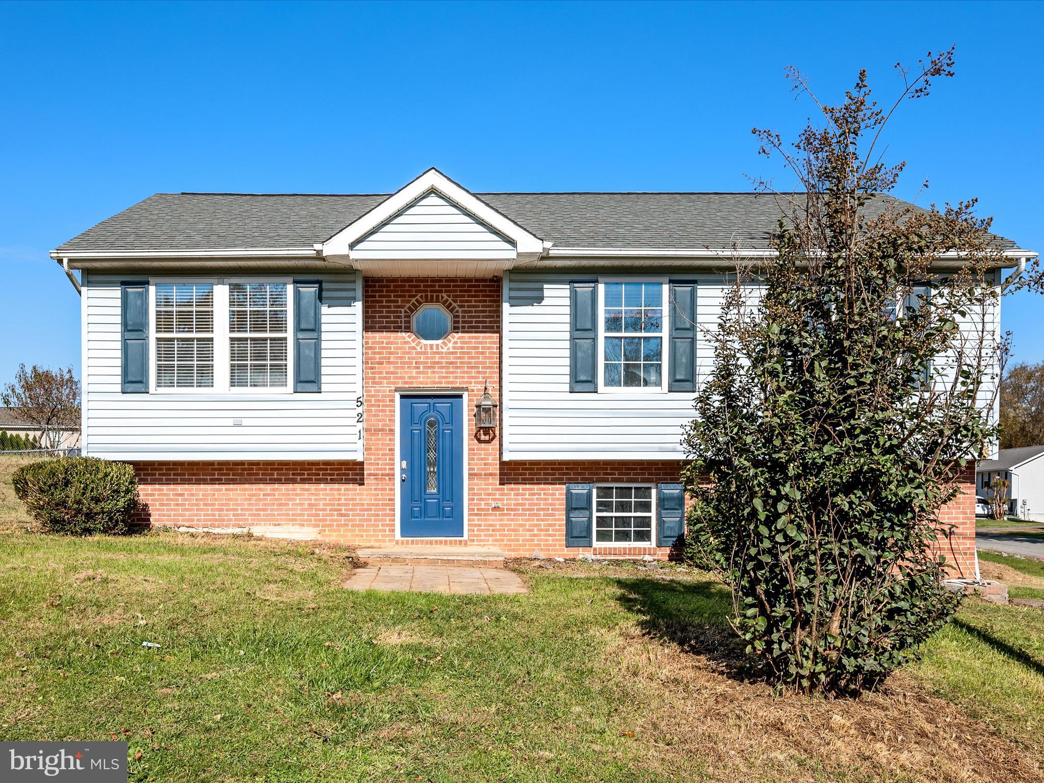 521 East 11th Avenue Ranson, WV 25438 - Photo 2 of 41 a front view of a house with garden