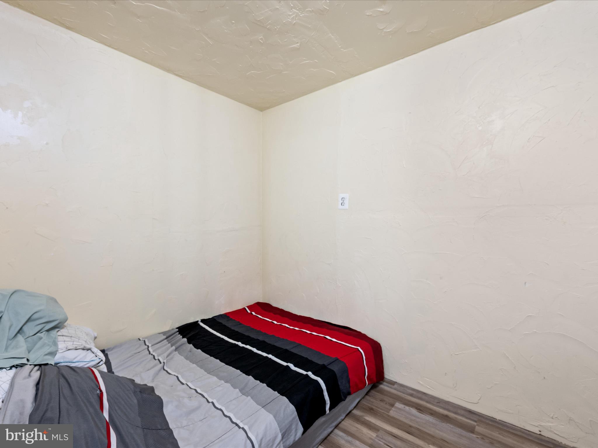 521 East 11th Avenue Ranson, WV 25438 - Photo 25 of 41 a bedroom with a bed and a lamp on the dresser