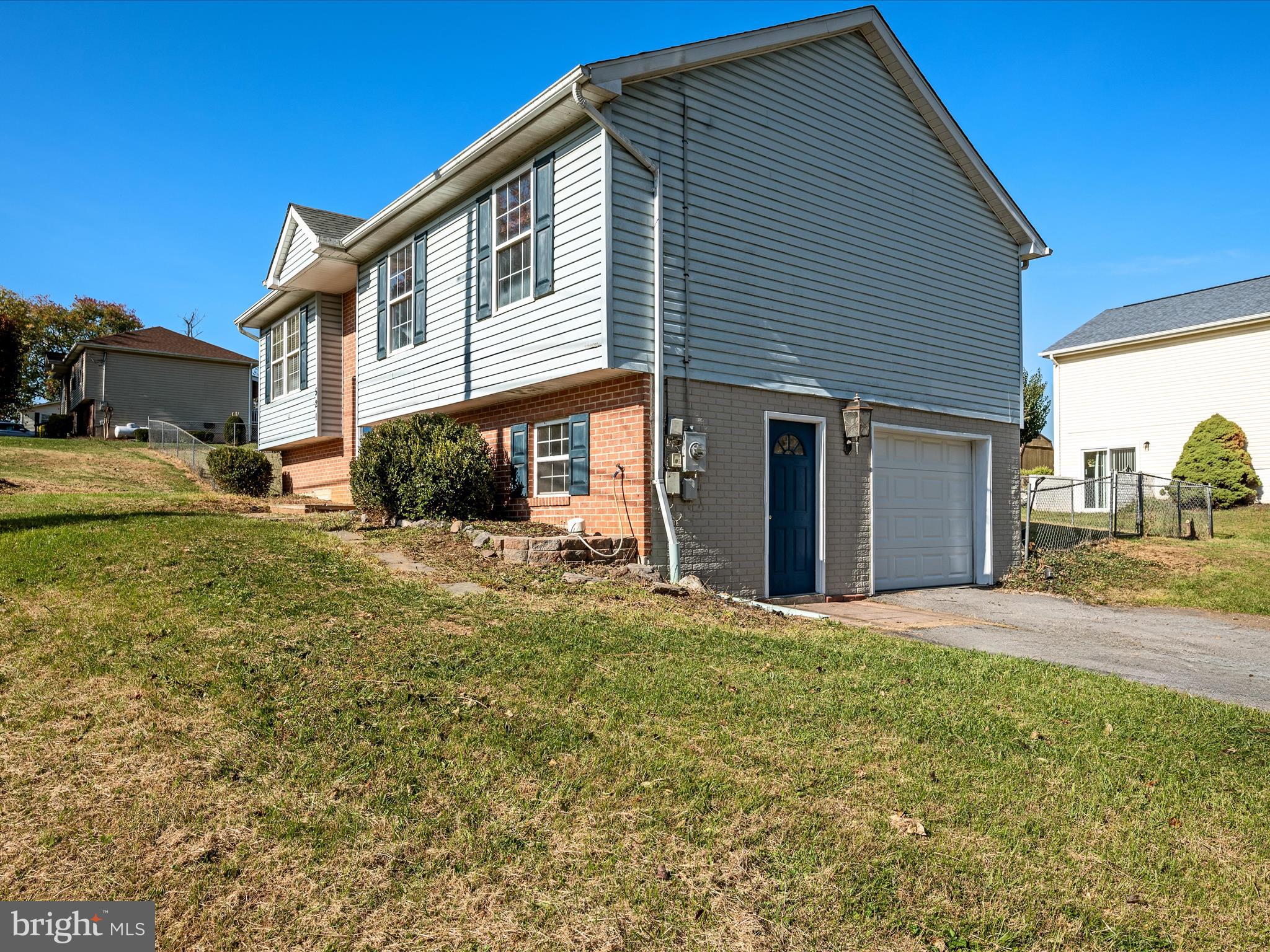 521 East 11th Avenue Ranson, WV 25438 - Photo 31 of 41 a front view of a house with a yard