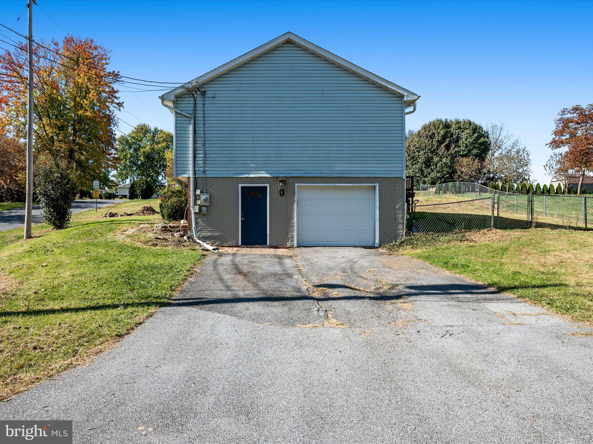 521 East 11th Avenue Ranson, WV 25438 - Photo 32 of 41 a front view of a house with a yard and garage