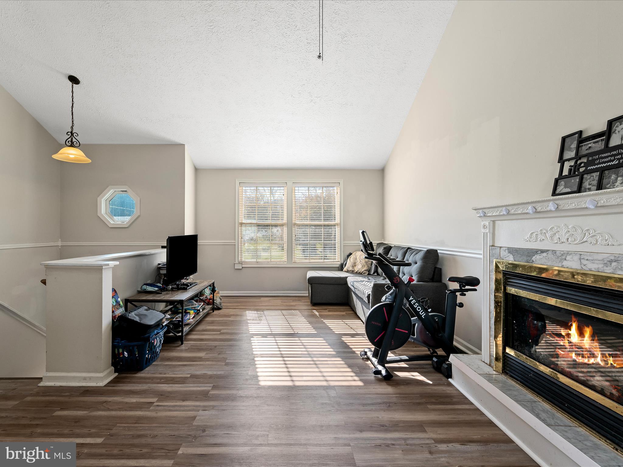 521 East 11th Avenue Ranson, WV 25438 - Photo 6 of 41 a view of a livingroom with a fireplace and workspace