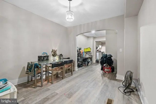 a view of a room with furniture and wooden floor