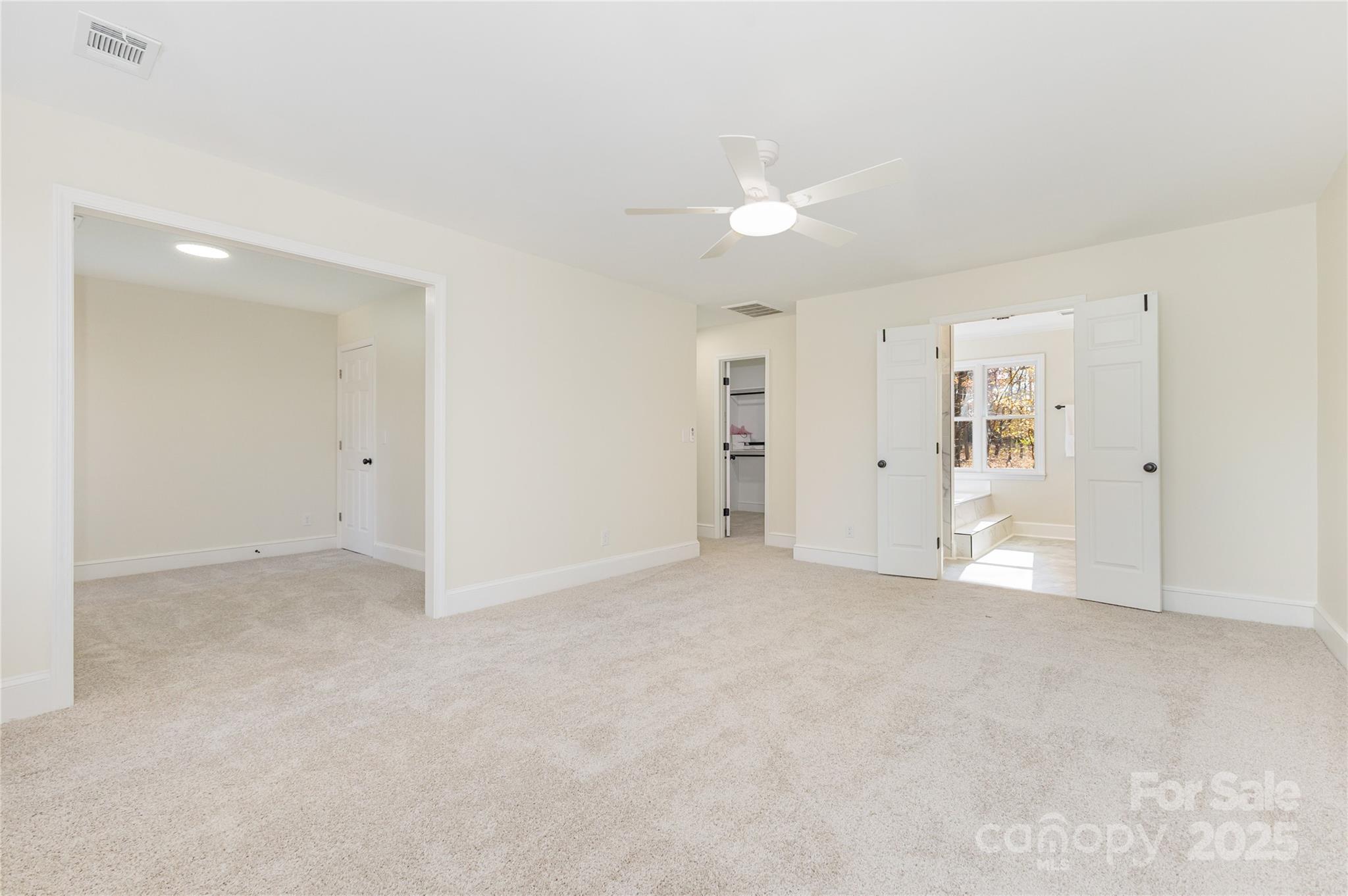 3335 Carnegie Lane Matthews, NC 28105 - Photo 11 of 31 an empty room with an entryway and fan