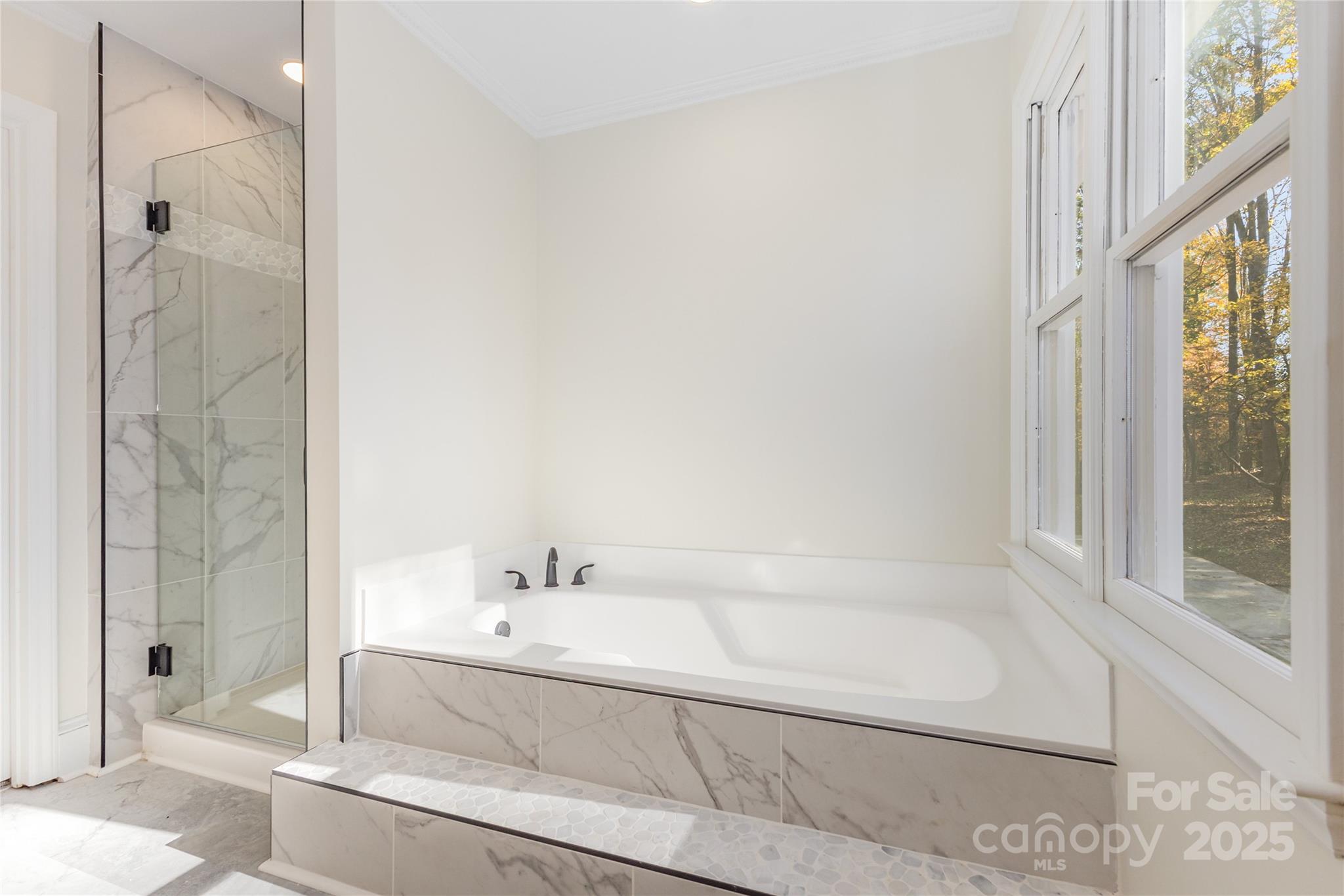 3335 Carnegie Lane Matthews, NC 28105 - Photo 15 of 31 a bathroom with a bathtub and shower