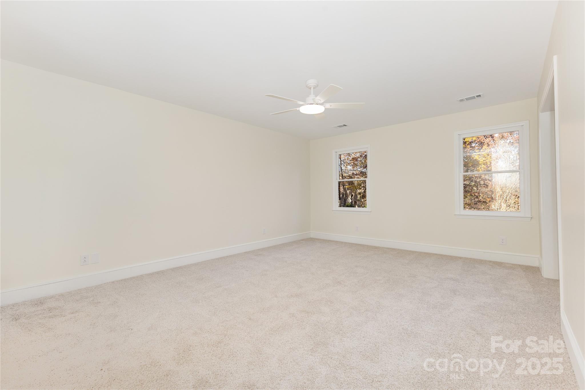 3335 Carnegie Lane Matthews, NC 28105 - Photo 17 of 31 an empty room with windows