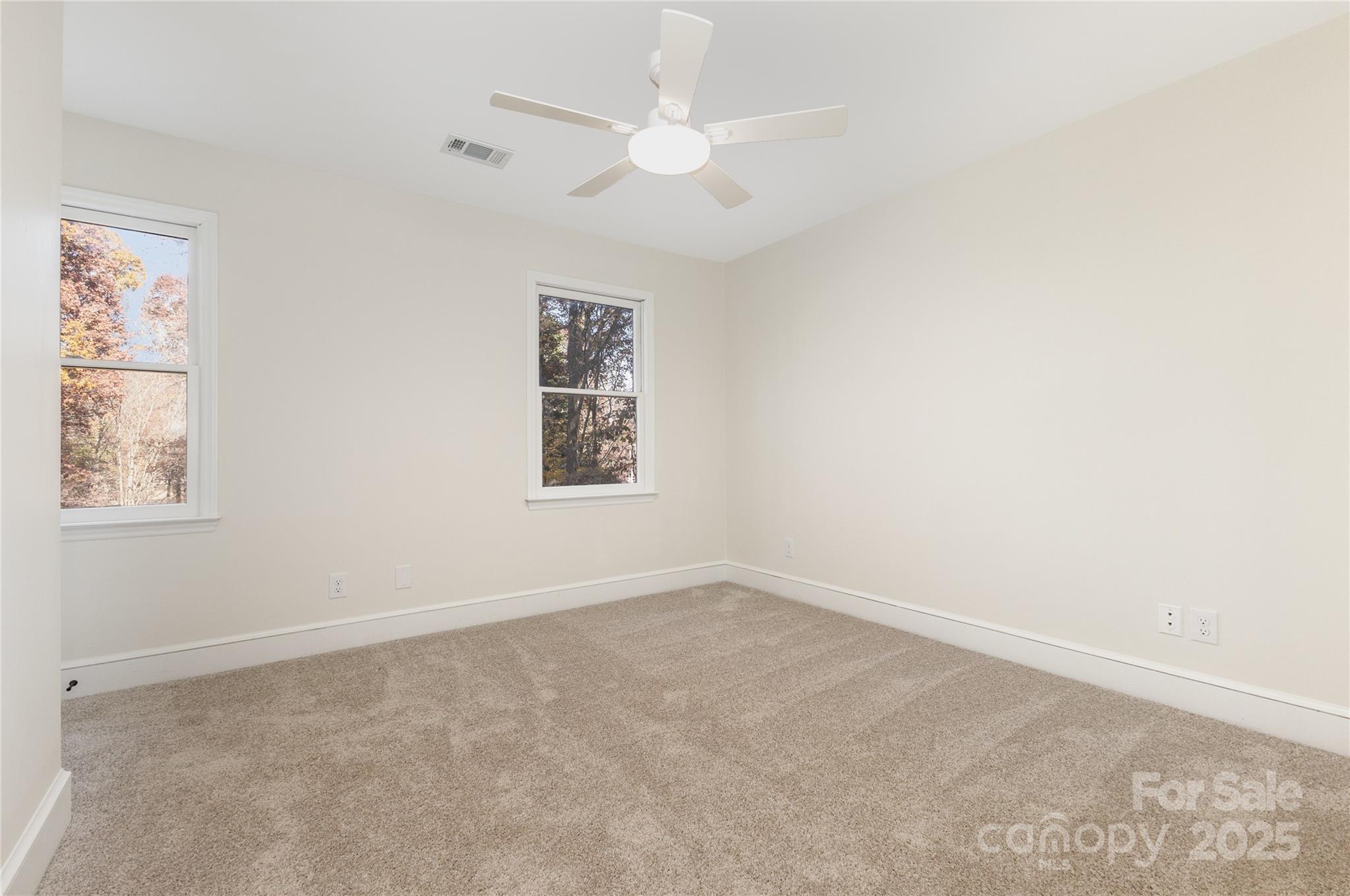 3335 Carnegie Lane Matthews, NC 28105 - Photo 18 of 31 an empty room with windows and fan