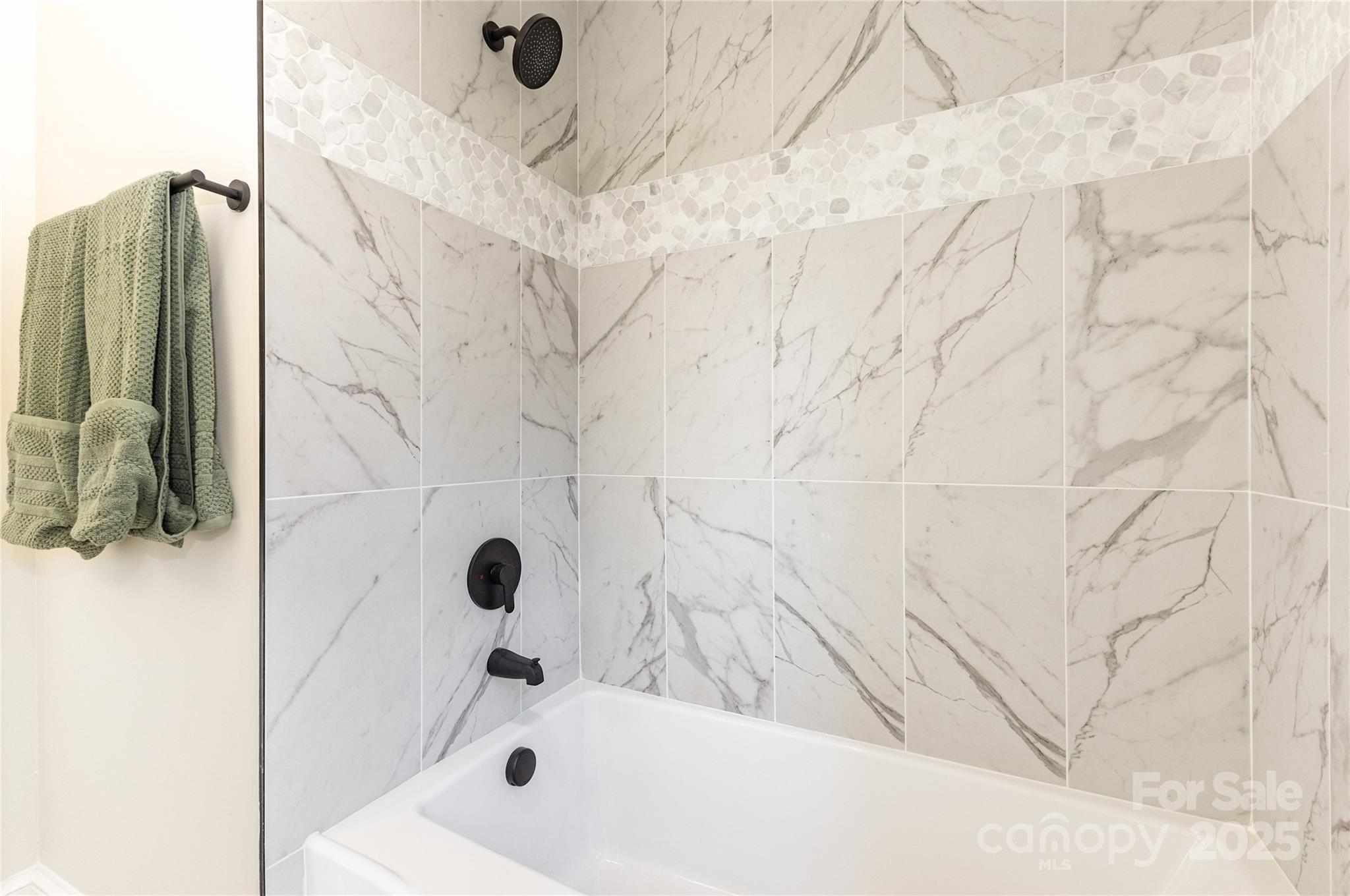 3335 Carnegie Lane Matthews, NC 28105 - Photo 23 of 31 a bathroom with a bathtub