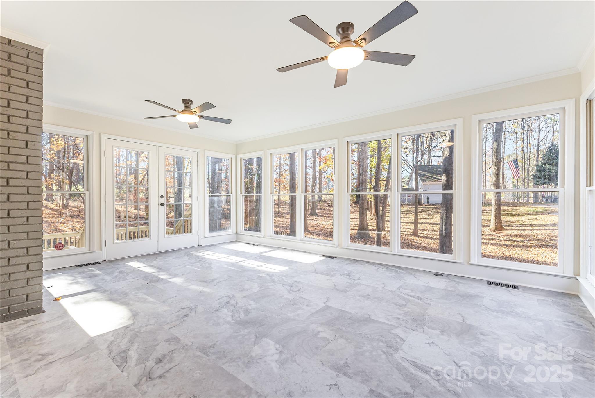 3335 Carnegie Lane Matthews, NC 28105 - Photo 27 of 31 a view of an empty room with a window and a ceiling fan