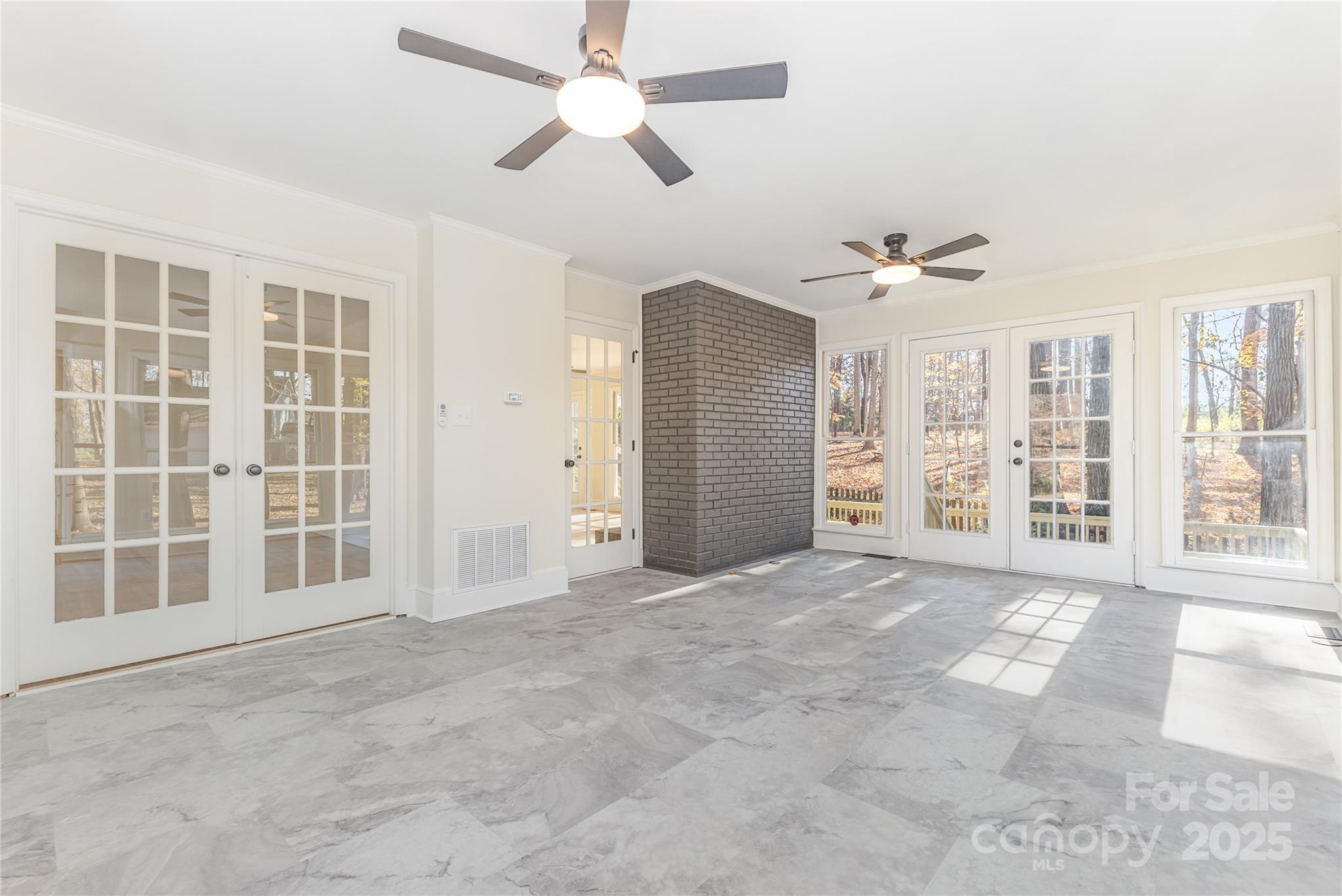 3335 Carnegie Lane Matthews, NC 28105 - Photo 28 of 31 a view of an empty room with a window and a ceiling fan