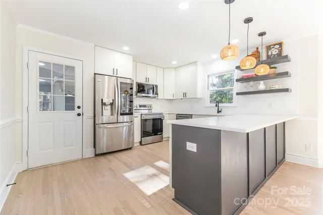 a view of a kitchen with a window