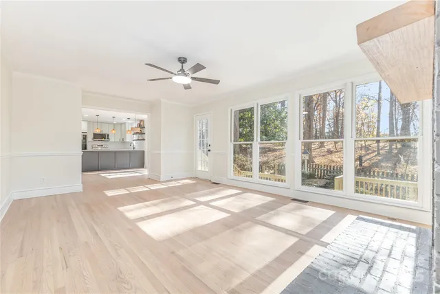 a view of an empty room with a fireplace