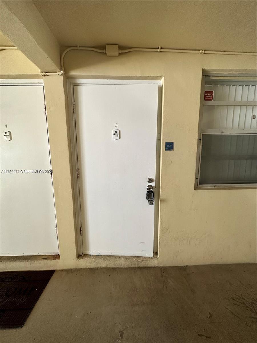 1100 Northeast 1st Court, Unit 105 Hallandale Beach, FL 33009 - Photo 12 of 13 a view of front door